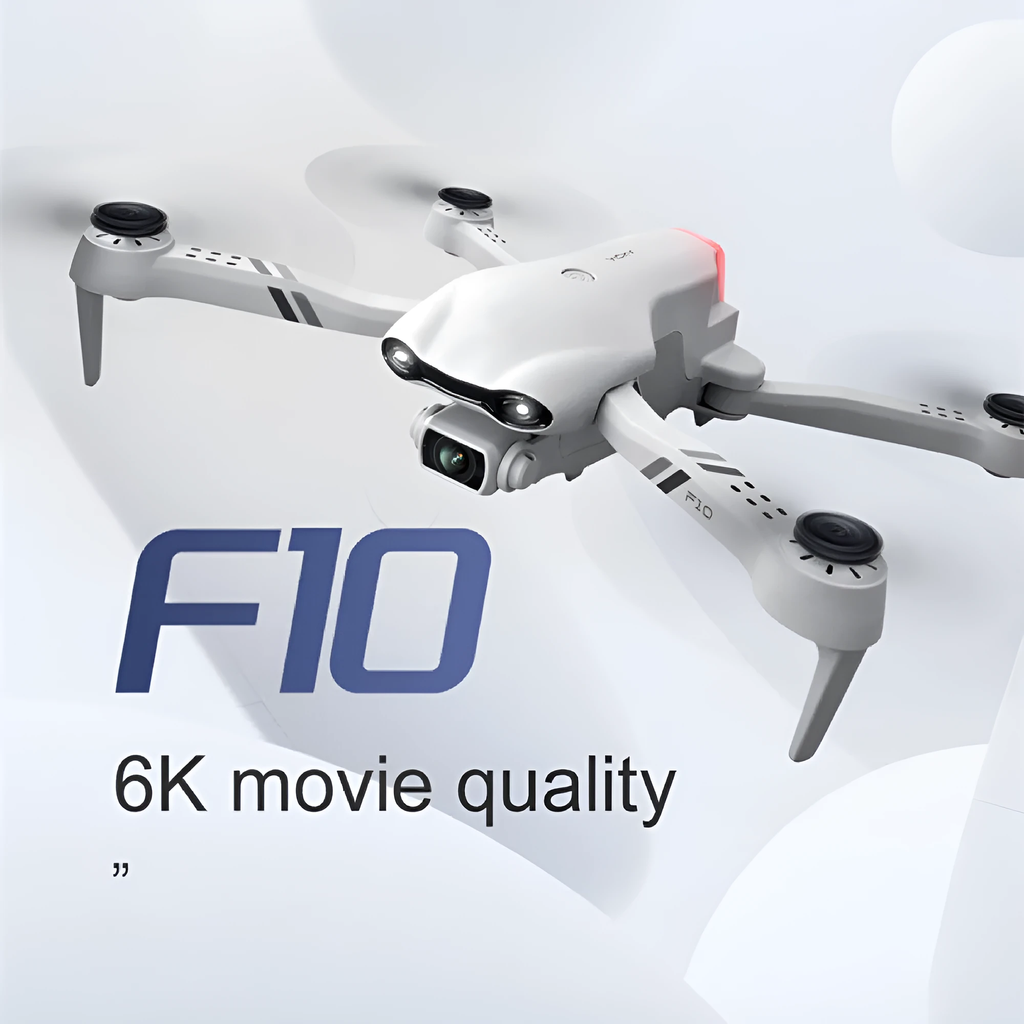 F10 folding GPS drone with 6K dual camera unfolded on a table showing propellers and camera