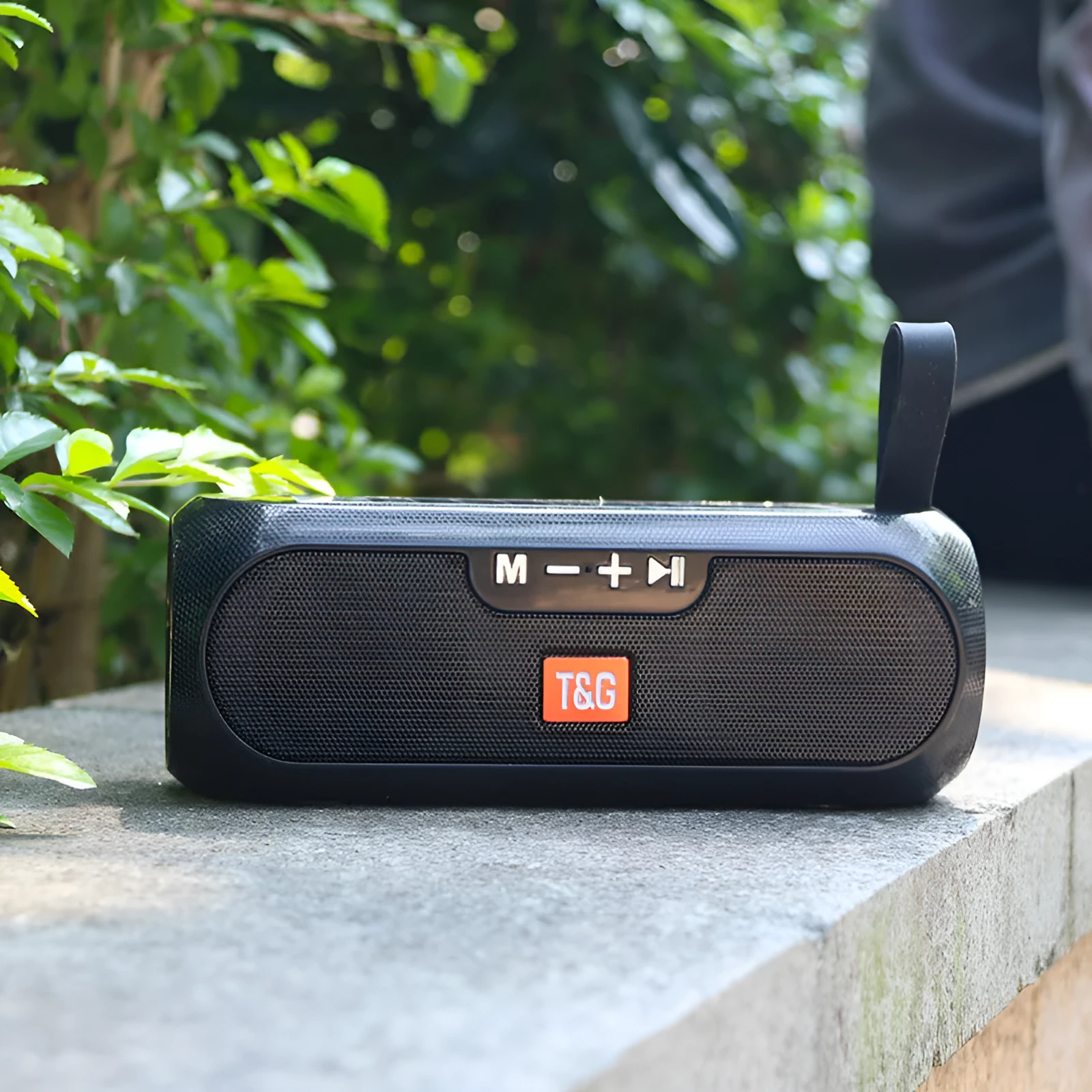 TG182 portable wireless Bluetooth speaker in black with cylindrical design and control buttons