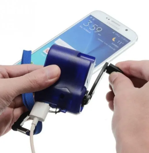 USB hand dynamo charger in green and blue showing winding handle and LED indicator
