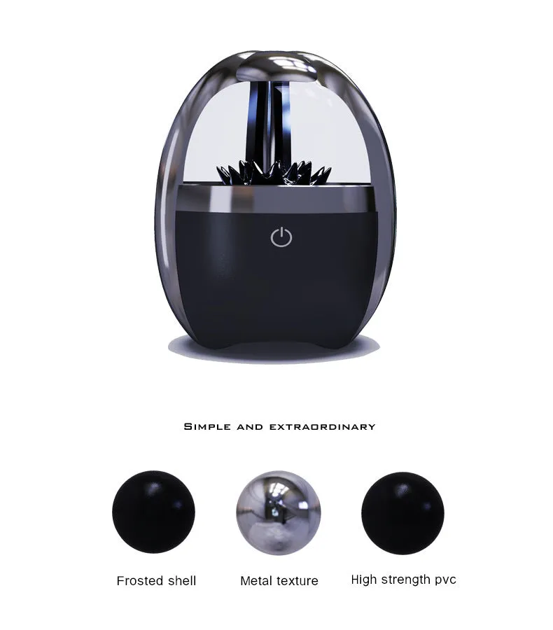 Magnetic fluid Bluetooth speaker in Silver Black with solid wood bracket on a table