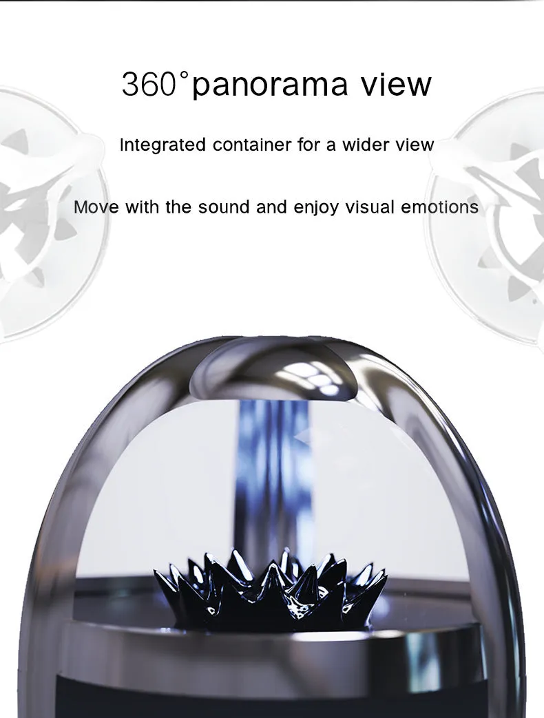 Magnetic fluid Bluetooth speaker in Silver Black with solid wood bracket on a table