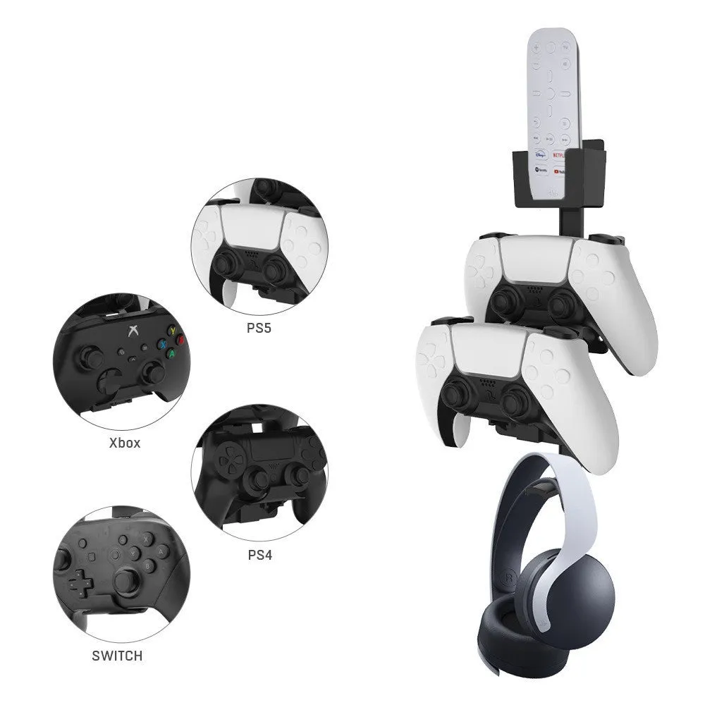 White wall-mounted storage hook holding PS5 controller and headphones