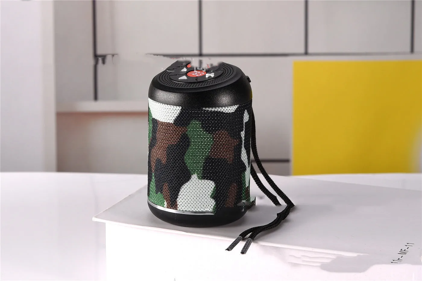 Portable outdoor Bluetooth subwoofer in multiple colours with radio, card playback, and call functions.
