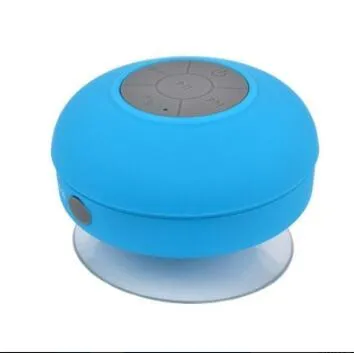 Portable Bluetooth speaker with suction cup showing front speaker grille and side buttons