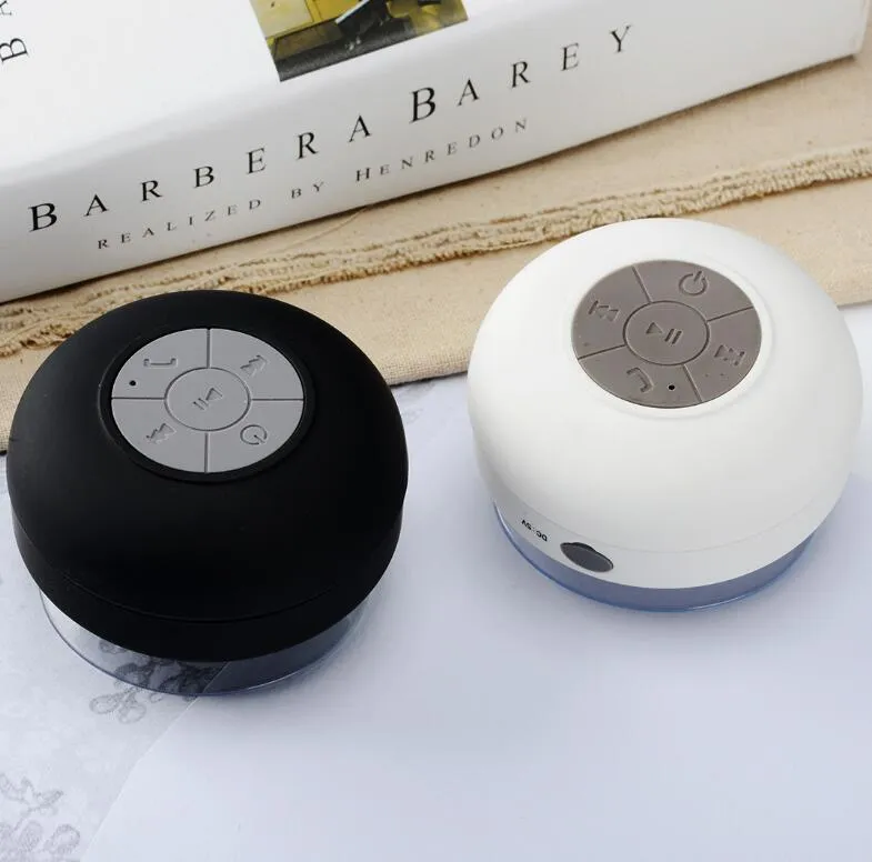 Portable Bluetooth speaker with suction cup showing front speaker grille and side buttons