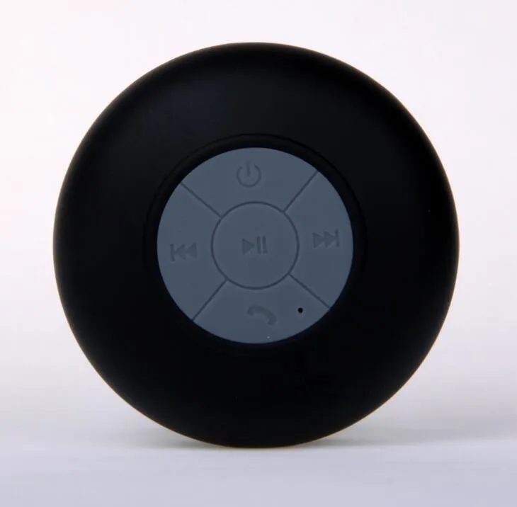Portable Bluetooth speaker with suction cup showing front speaker grille and side buttons