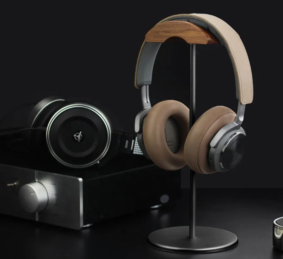 Aviation aluminium earphone holder in grey with anodized finish on a desk