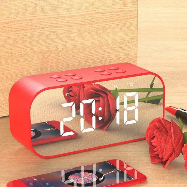 Wireless Bluetooth speaker with LED clock display showing time, black colour, compact ABS body on a desk
