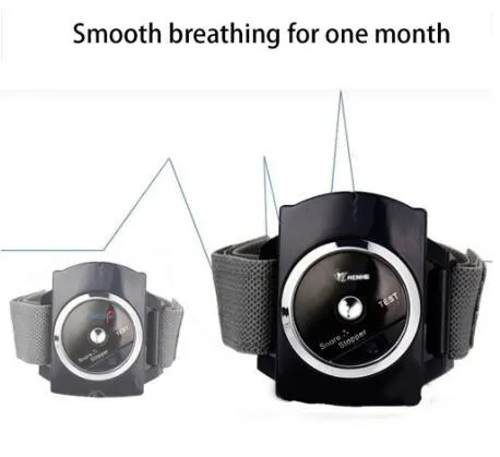 Black ABS anti snore wristband with biosensor and infrared therapy displayed on a flat surface