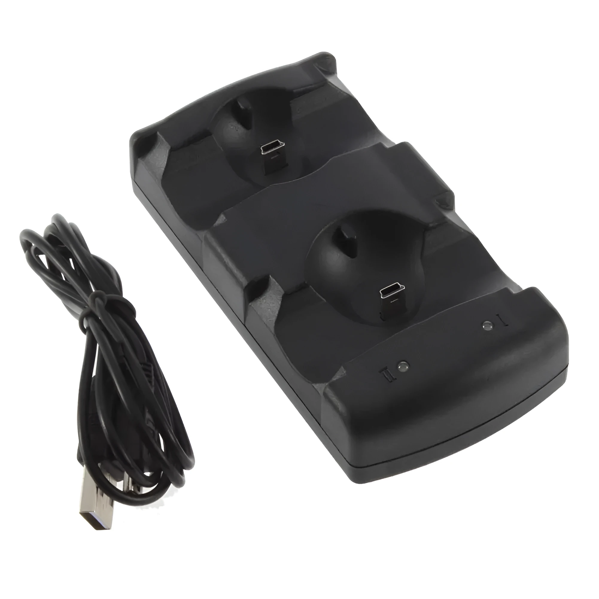 Black plastic dual USB charging dock for PlayStation 3 wireless controllers on a table.