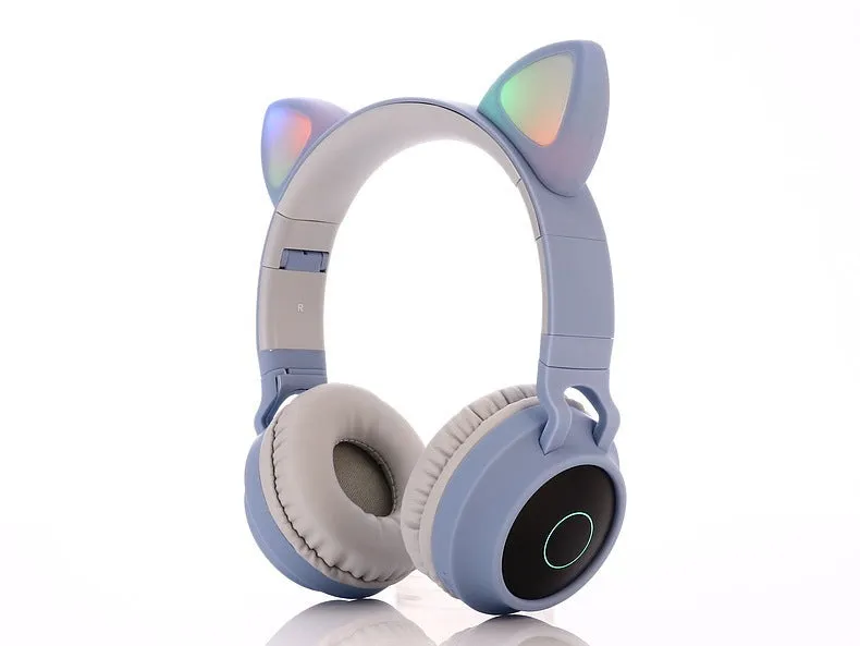 Cute Bluetooth 5.0 wireless headset in pink, foldable design with padded ear cups and 3.5mm audio port