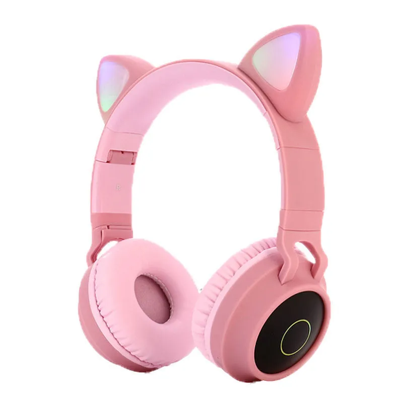 Cute Bluetooth 5.0 wireless headset in pink, foldable design with padded ear cups and 3.5mm audio port