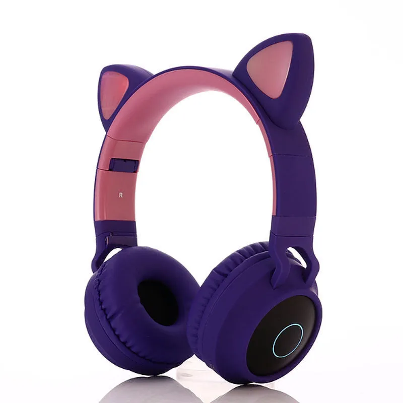 Cute Bluetooth 5.0 wireless headset in pink, foldable design with padded ear cups and 3.5mm audio port