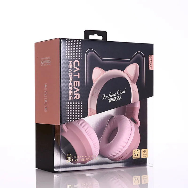 Cute Bluetooth 5.0 wireless headset in pink, foldable design with padded ear cups and 3.5mm audio port