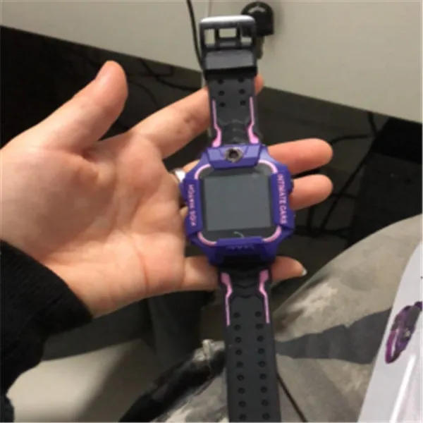Children's smart watch with dual cameras, SOS button, and touch screen on a child's wrist