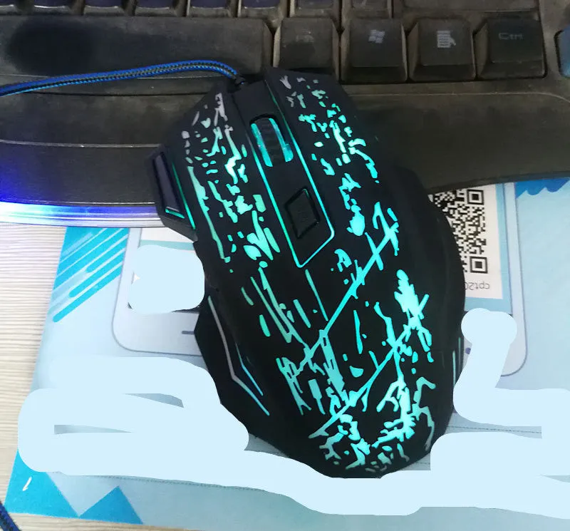 Betas wired optical gaming mouse with seven buttons, colourful glowing lights, and USB cable for desktop PC gaming