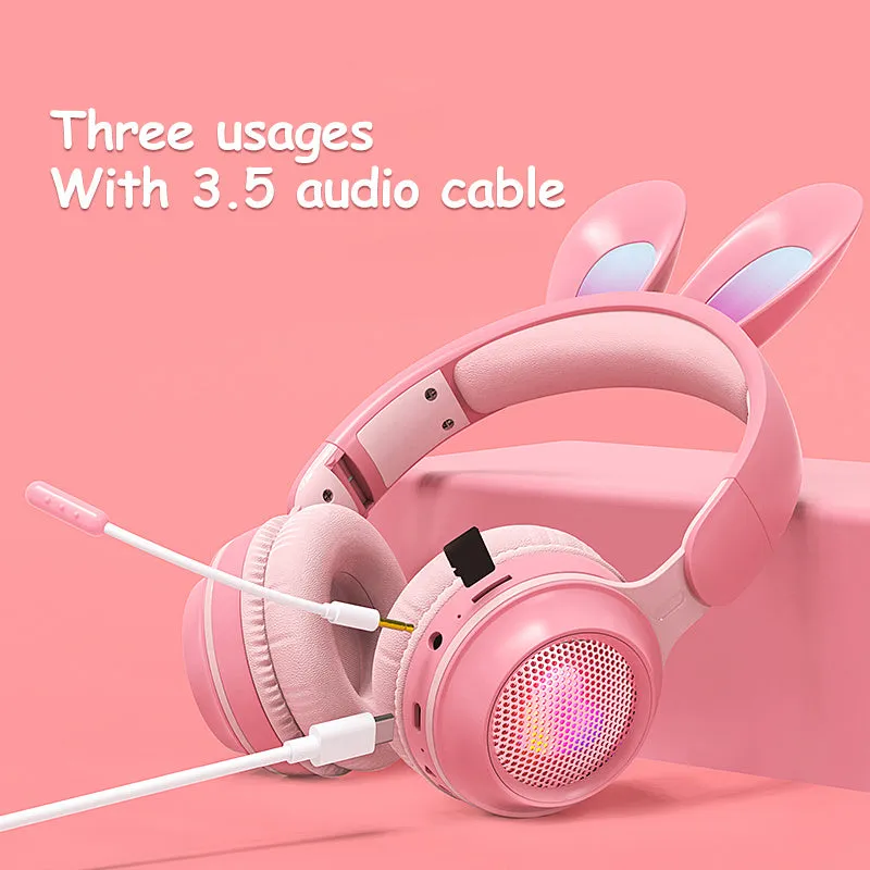 Wireless rabbit ear headphones with RGB LED ears in pink, foldable design on white background