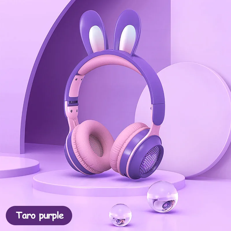 Wireless rabbit ear headphones with RGB LED ears in pink, foldable design on white background