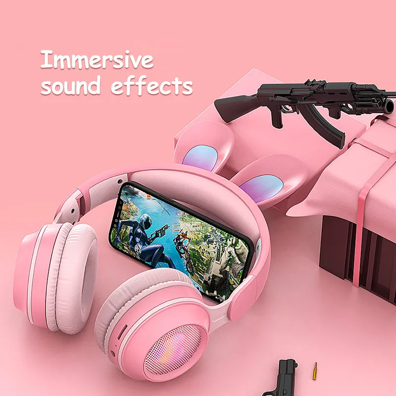 Wireless rabbit ear headphones with RGB LED ears in pink, foldable design on white background