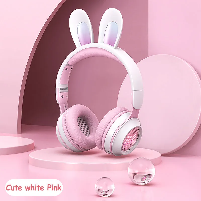 Wireless rabbit ear headphones with RGB LED ears in pink, foldable design on white background