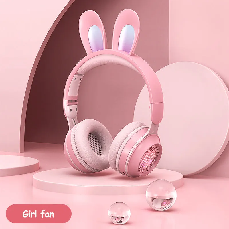 Wireless rabbit ear headphones with RGB LED ears in pink, foldable design on white background