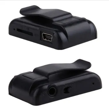 Black plastic clip MP3 player with TF card slot and mini USB port on a plain background