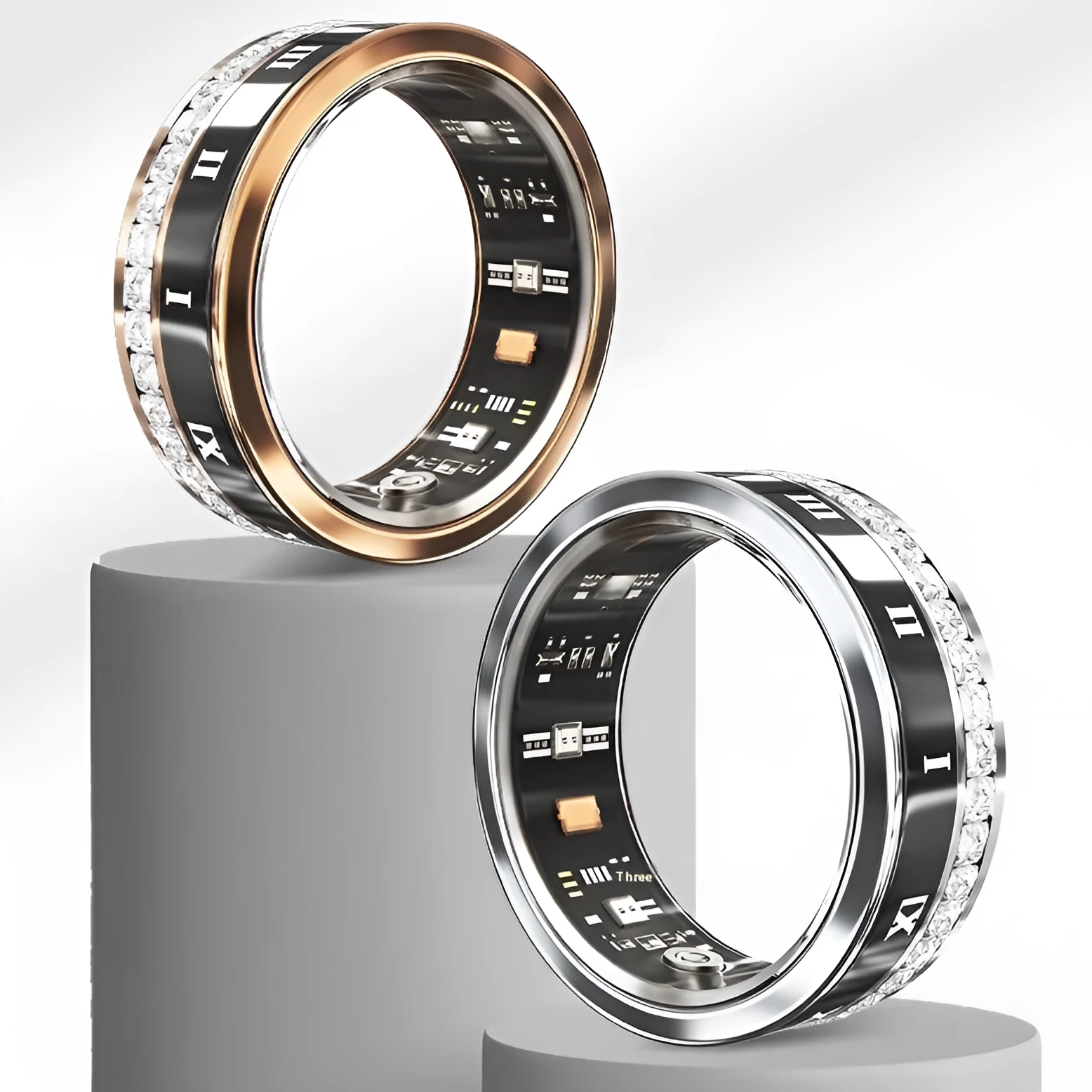Gold and silver diamond inlaid smart ring for health and blood oxygen tracking on a finger.