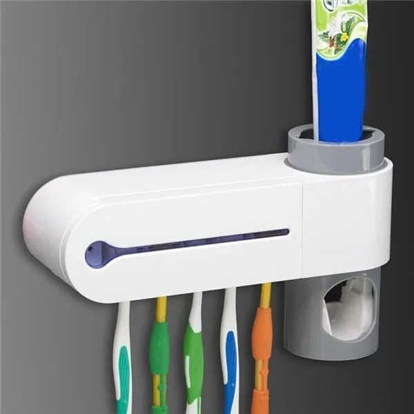 White ABS 3-in-1 toothbrush holder with UV steriliser and toothpaste dispenser, wall mounted with five slots