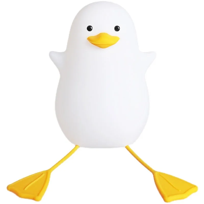 Little Gull rechargeable silicone night light in blue mouth on a bedside table