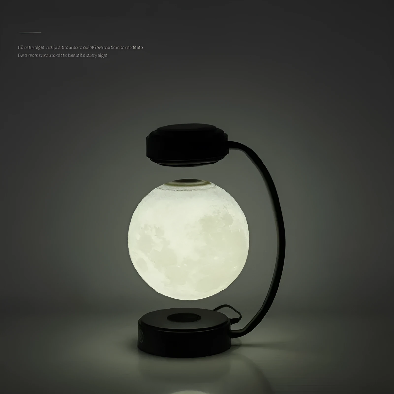 3D LED moon night light with magnetic levitation, floating ball, iron base, black finish on a desk