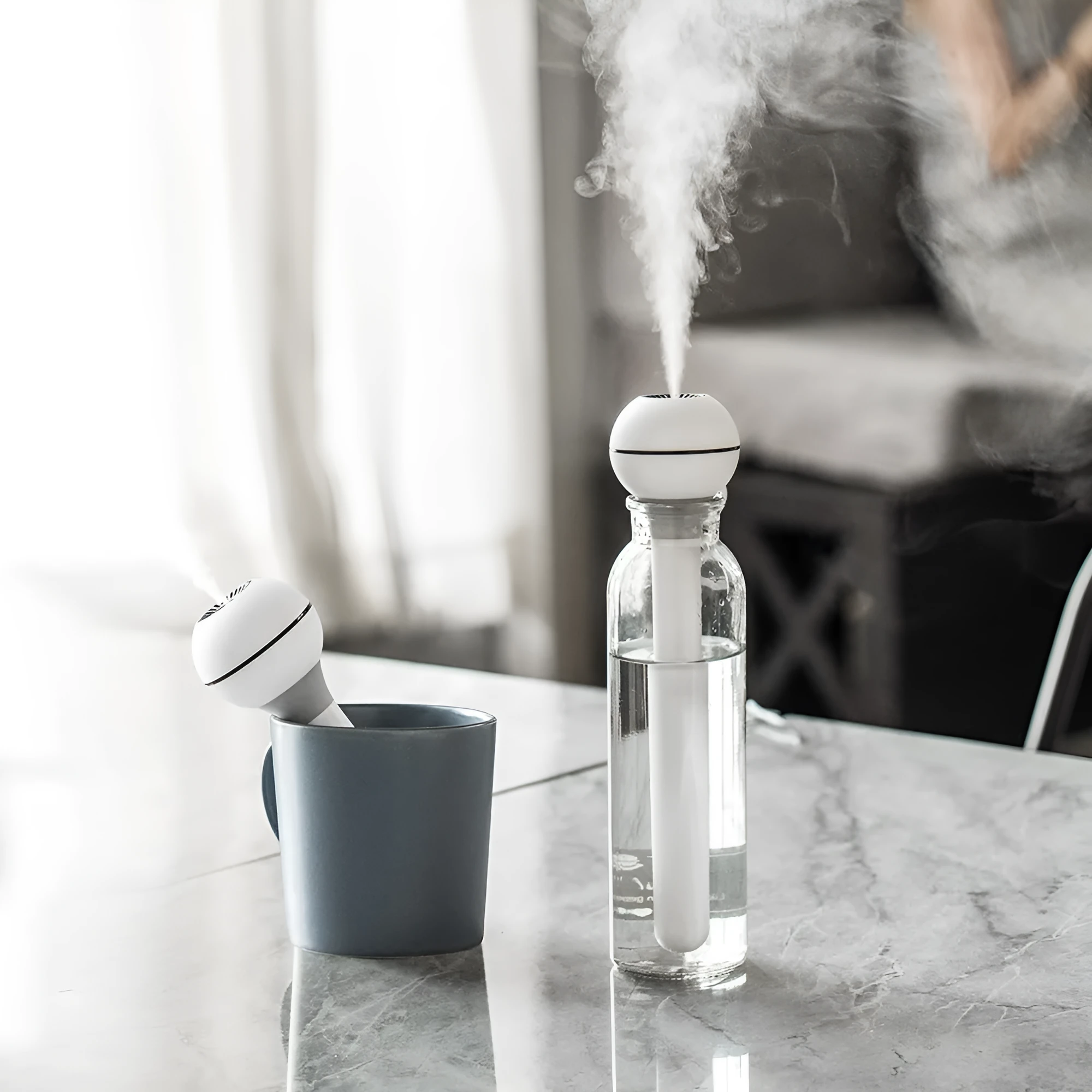 Columnar pink and white magic wand ultrasonic humidifier with USB cable and 1 litre water tank