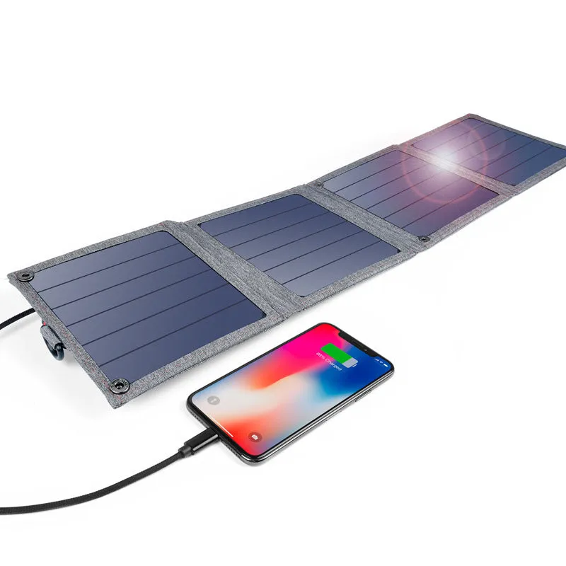 Grey foldable solar charger with USB port for mobile phone and tablet charging outdoors