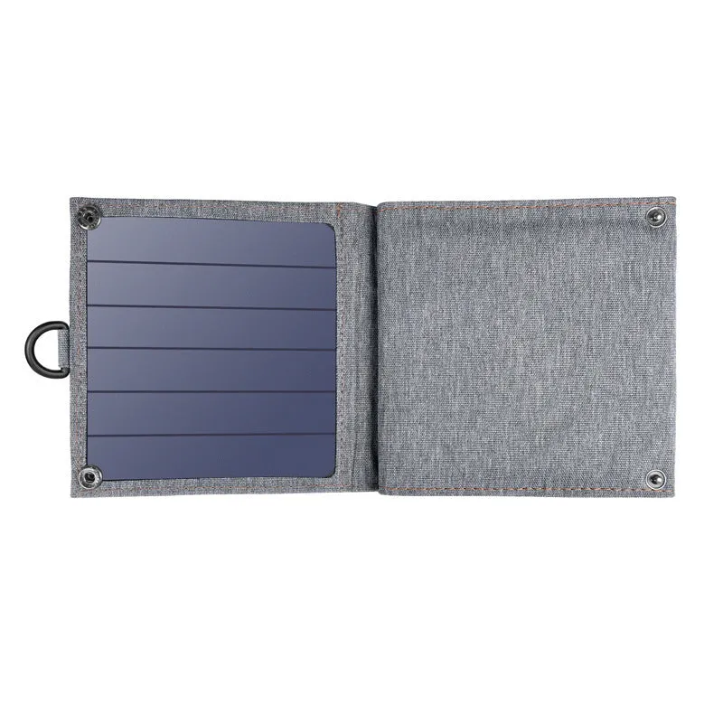 Grey foldable solar charger with USB port for mobile phone and tablet charging outdoors