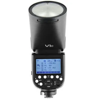Black DSLR overhead flash with circular lamp head on mini base, with lithium battery and accessories for studio photography