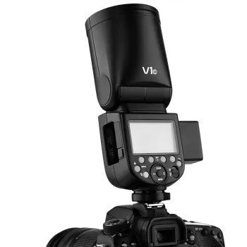 Black DSLR overhead flash with circular lamp head on mini base, with lithium battery and accessories for studio photography