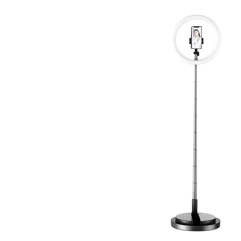 Portable 290mm LED selfie ring light in black on table, showing centre phone holder and adjustable brightness button