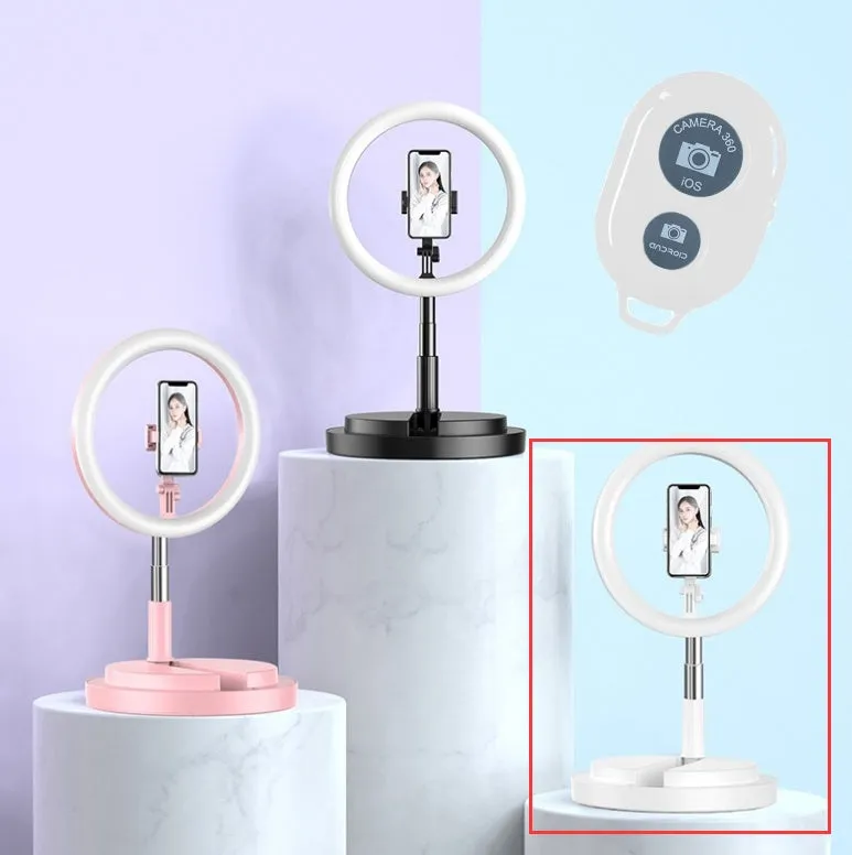 Portable 290mm LED selfie ring light in black on table, showing centre phone holder and adjustable brightness button