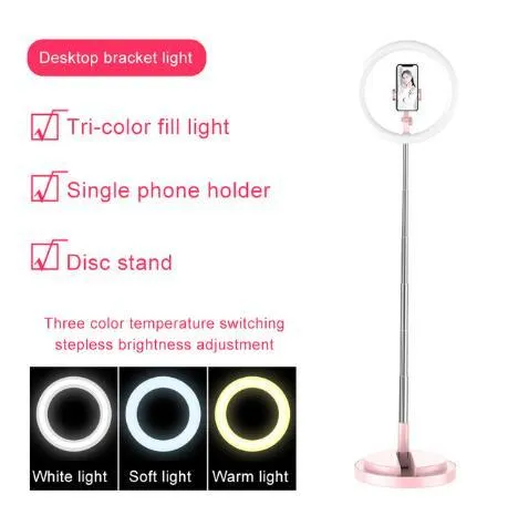 Portable 290mm LED selfie ring light in black on table, showing centre phone holder and adjustable brightness button