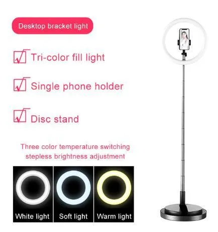 Portable 290mm LED selfie ring light in black on table, showing centre phone holder and adjustable brightness button