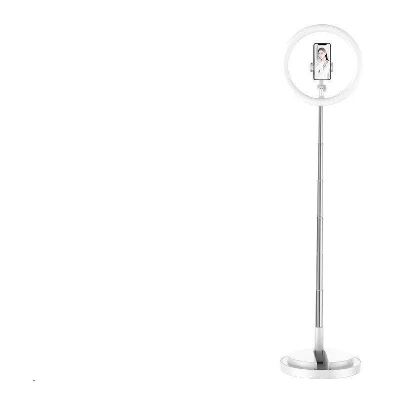 Portable 290mm LED selfie ring light in black on table, showing centre phone holder and adjustable brightness button