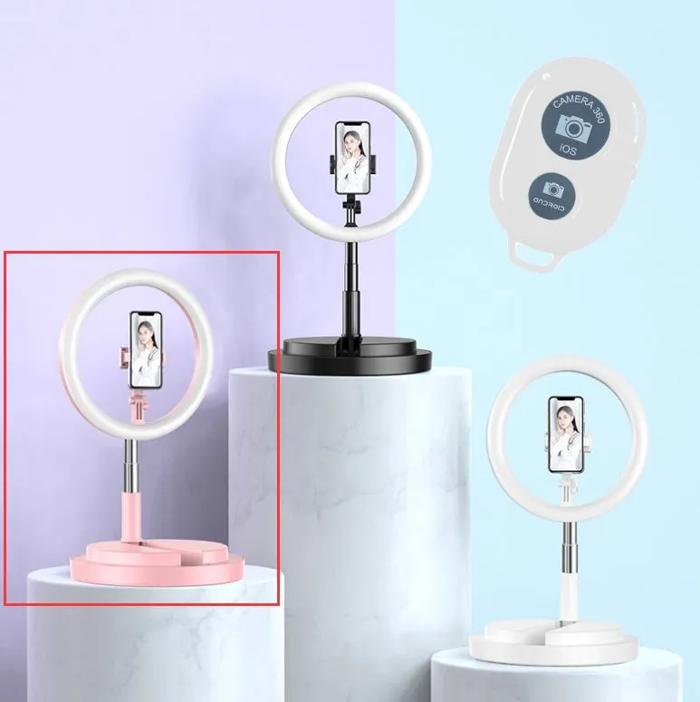 Portable 290mm LED selfie ring light in black on table, showing centre phone holder and adjustable brightness button