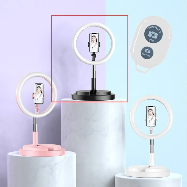 Portable 290mm LED selfie ring light in black on table, showing centre phone holder and adjustable brightness button