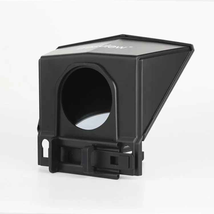 Portable small black cell phone teleprompter with adapter rings and remote control on a table
