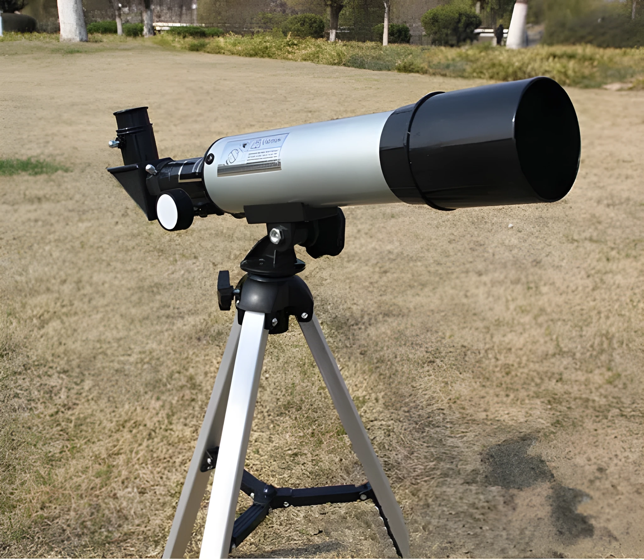 Silver telescope on aluminium tripod with multiple eyepieces and moon lens for stargazing