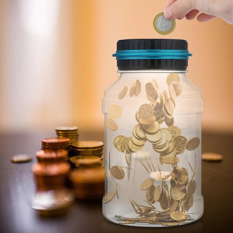 Transparent digital coin counting money box with LCD screen on lid, showing coin slot and clear jar body