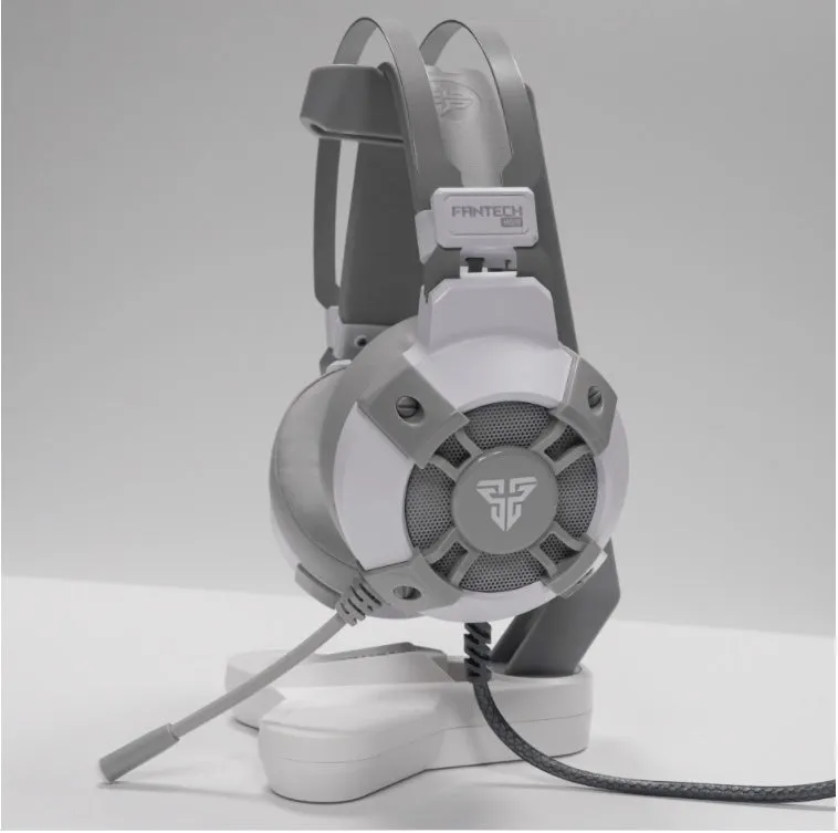 Black FANTECH HG11 USB gaming headset with over-ear cups and RGB lighting on a stand.