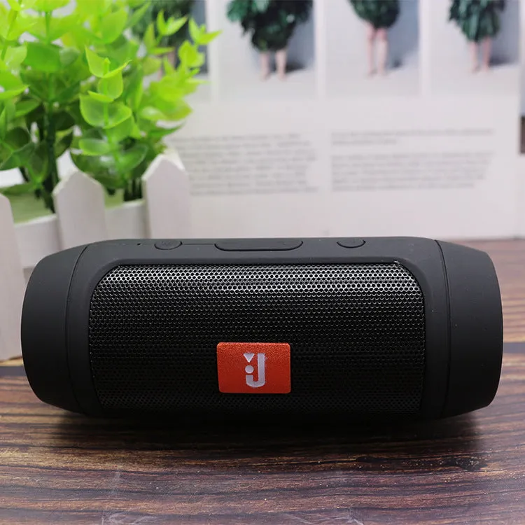 Waterproof Bluetooth speaker in black with USB charging port and control buttons