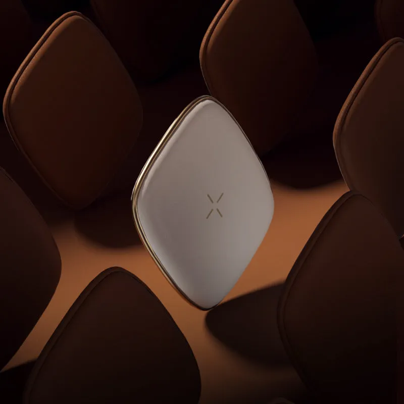 White compact wireless fast charger on a sofa, measuring 98mm by 95mm by 115mm, with USB interface