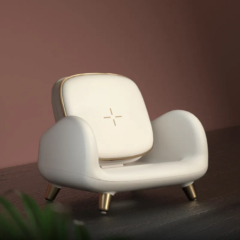 White compact wireless fast charger on a sofa, measuring 98mm by 95mm by 115mm, with USB interface