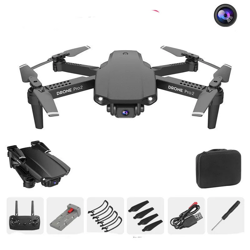E99Pro2 folding dual camera drone black with propellers on table